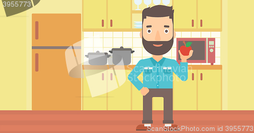 Image of Man holding apple.