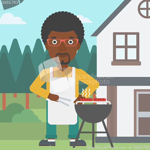 Image of Man preparing barbecue.