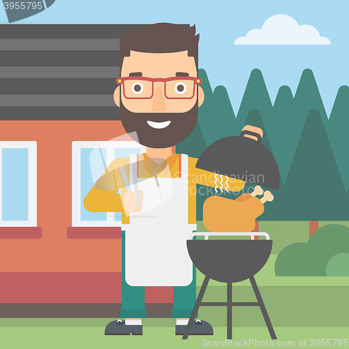 Image of Man preparing barbecue.