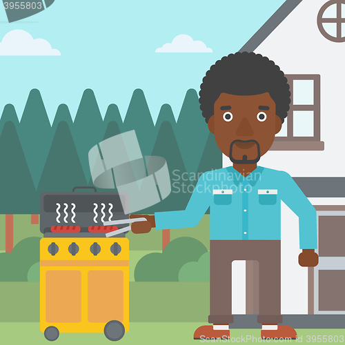 Image of Man preparing barbecue.