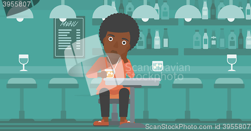 Image of Woman sitting at bar.