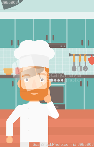 Image of Chef pointing forefinger up.