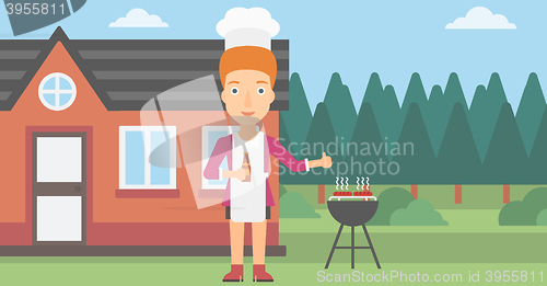 Image of Woman preparing barbecue.