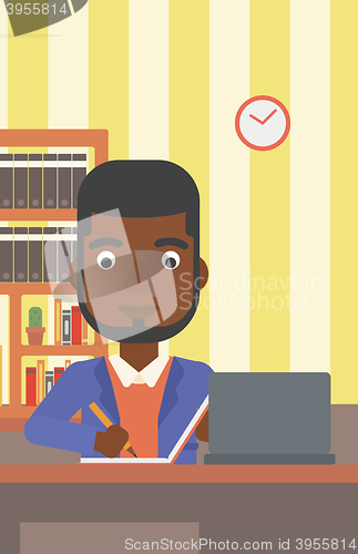 Image of Man using laptop for education.