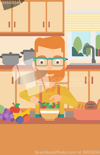 Image of Man cooking vegetable salad.