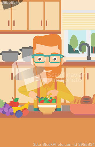 Image of Man cooking vegetable salad.