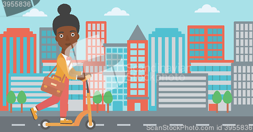 Image of Woman riding on scooter.