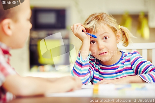 Image of Siblings are doing homework 