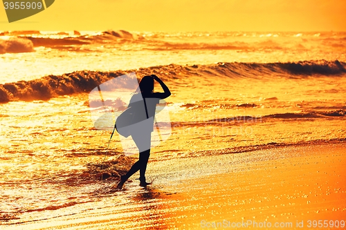 Image of Silhouette of the surfer girl 