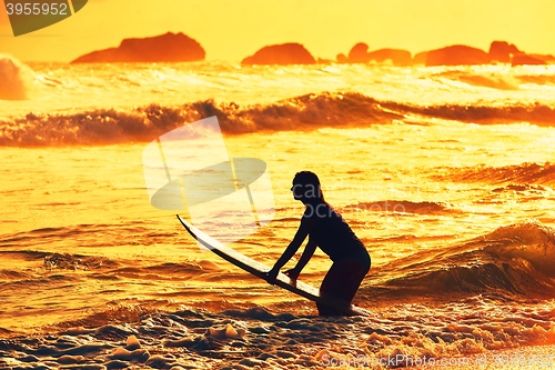 Image of Silhouette of the surfer girl