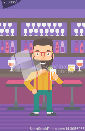 Image of Man holding glass of juice.