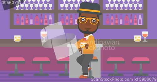 Image of Man sitting at bar.