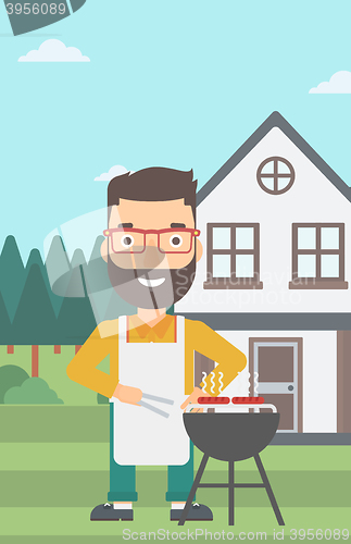 Image of Man preparing barbecue.