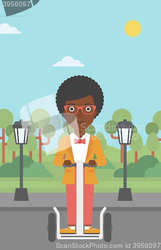 Image of Woman riding on electric scooter.