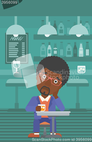 Image of Man sitting at bar.