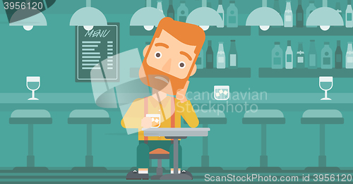 Image of Man sitting at bar.