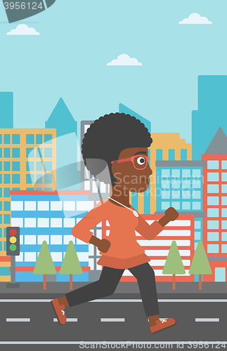 Image of Sportive woman jogging.