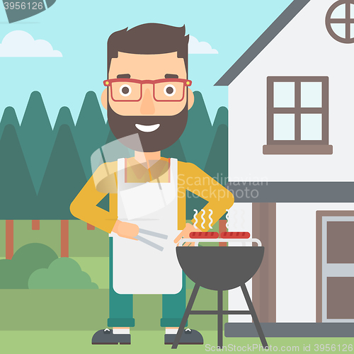 Image of Man preparing barbecue.