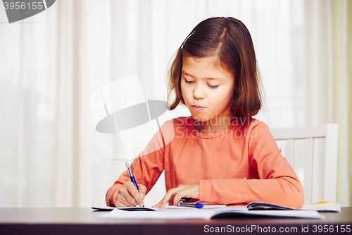 Image of Girl is doing homework 