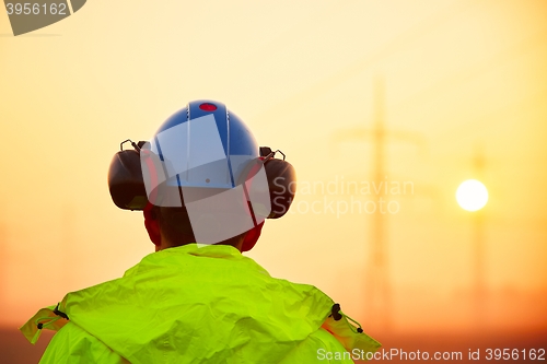 Image of Worker at the sunrise