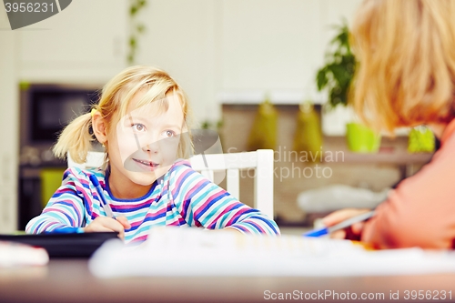 Image of Siblings are doing homework 