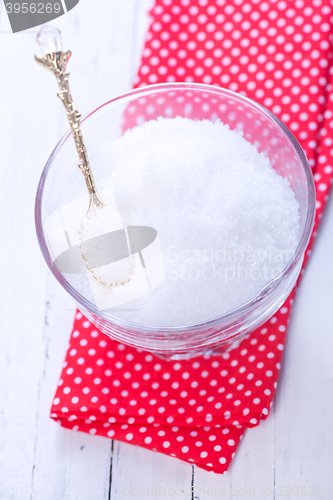 Image of white sugar in glass bank