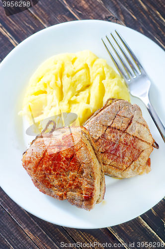 Image of mashed potato and fried meat