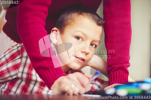 Image of Boy is doing homework