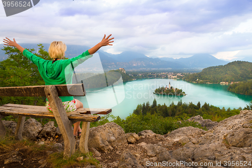 Image of Woman enjoying panoramic view of Lake Bled, Slovenia.