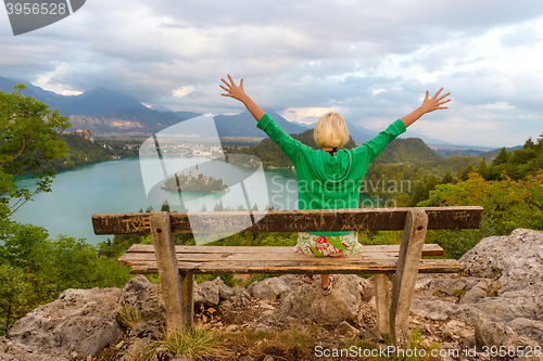 Image of Woman enjoying panoramic view of Lake Bled, Slovenia.