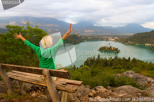 Image of Woman enjoying panoramic view of Lake Bled, Slovenia.