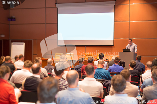 Image of Business speaker giving a talk in conference hall.