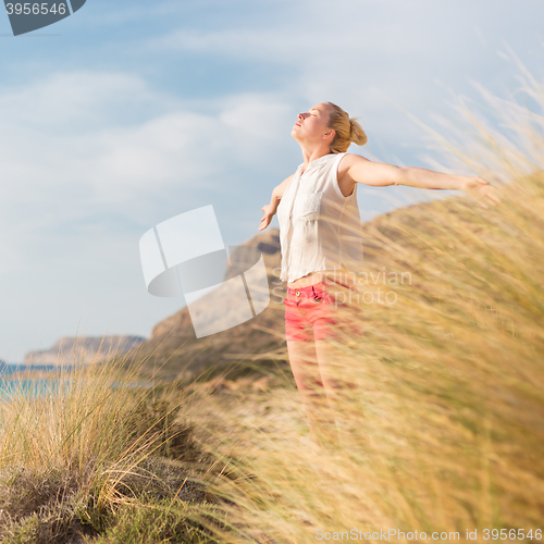 Image of Free Happy Woman Enjoying Sun on Vacations.