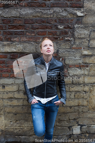 Image of Fashion street style portrait of young woman.