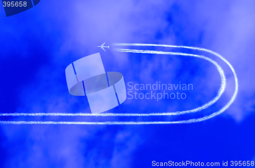 Image of  Airplane in the sky with jet trail