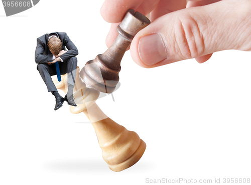 Image of Businessman on a chess piece