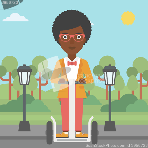 Image of Woman riding on electric scooter.