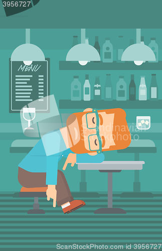 Image of Man sleeping in bar. 