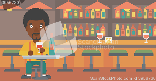 Image of Man sitting at bar.