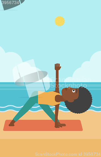 Image of Woman practicing yoga.