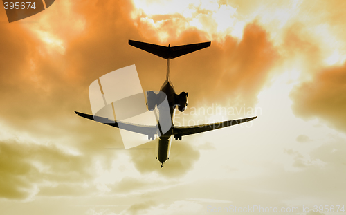 Image of  jet landing at dusk.