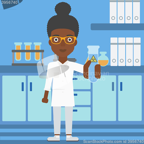 Image of Laboratory assistant with test tube.