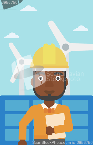 Image of Man holding tablet computer.