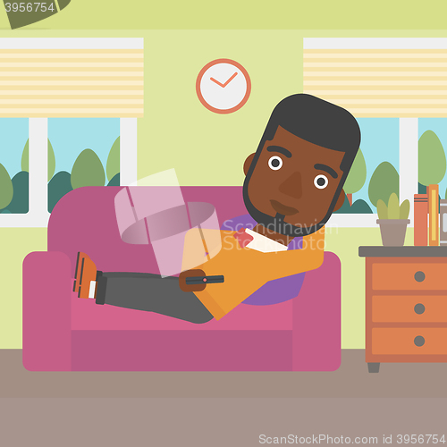 Image of Man lying on sofa.