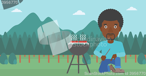 Image of Man preparing barbecue.