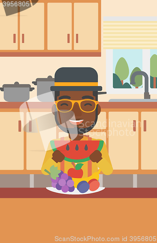 Image of Man eating watermelon.