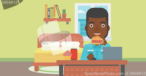 Image of Man eating hamburger. 