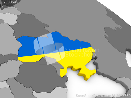 Image of Ukraine on globe with flag