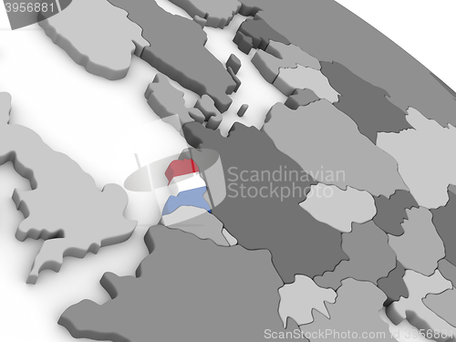 Image of Netherlands on globe with flag