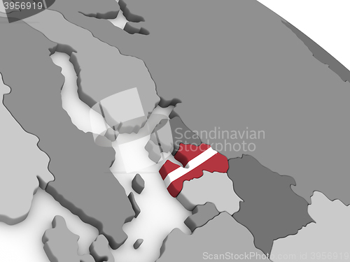 Image of Latvia on globe with flag